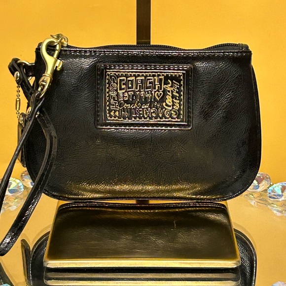 Coach Handbags - Coach Poppy Black Wristlet Approx. 6.5 x 4